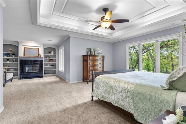 5316 NE Northgate Xing, Lees Summit, MO 64064 - bedroom with a tray ceiling, carpet floors, a tile fireplace, baseboards, and a ceiling fan