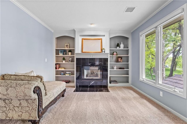 5316 NE Northgate Xing, Lees Summit, MO 64064 - living area with crown molding, carpet floors, a wood stove, healthy amount of natural light, and built in shelves
