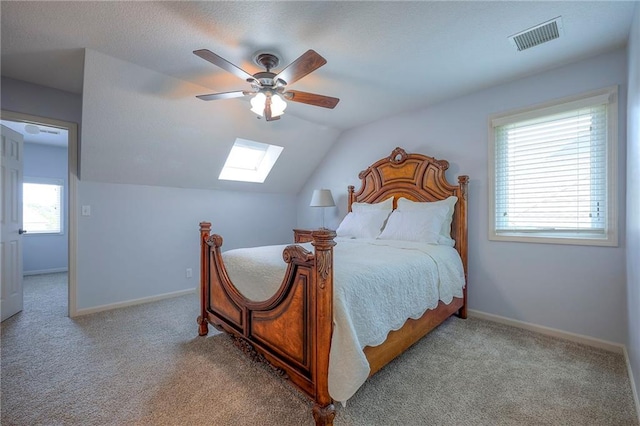 5316 NE Northgate Xing, Lees Summit, MO 64064 - bedroom with a skylight, carpet floors, vaulted ceiling, ceiling fan, and baseboards