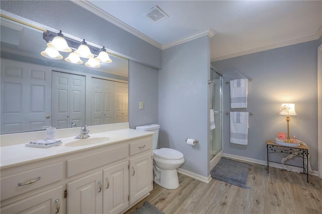 5316 NE Northgate Xing, Lees Summit, MO 64064 - bathroom featuring toilet, wood finished floors, vanity, a shower stall, and crown molding