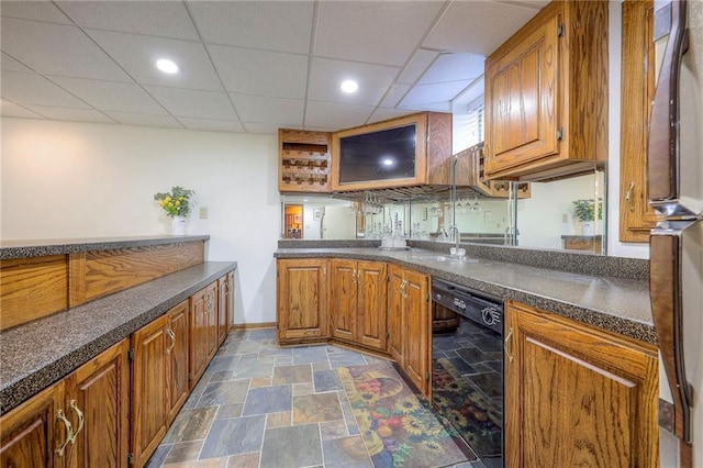 5316 NE Northgate Xing, Lees Summit, MO 64064 - kitchen featuring dishwasher, fridge, dark countertops, brown cabinetry, and stone finish flooring