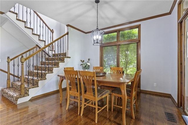 5316 NE Northgate Xing, Lees Summit, MO 64064 - dining room with a chandelier, ornamental molding, wood finished floors, stairs, and baseboards