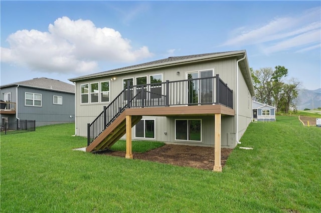 1002 Branchwood Ln, Raymore, MO 64083 - rear view of property with a lawn, stairs, and a deck