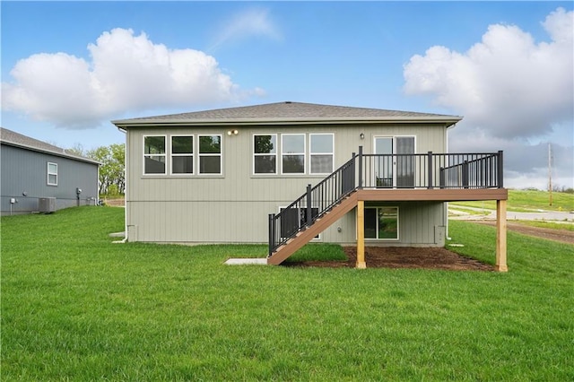 1002 Branchwood Ln, Raymore, MO 64083 - rear view of house featuring stairs, a wooden deck, a yard, and cooling unit