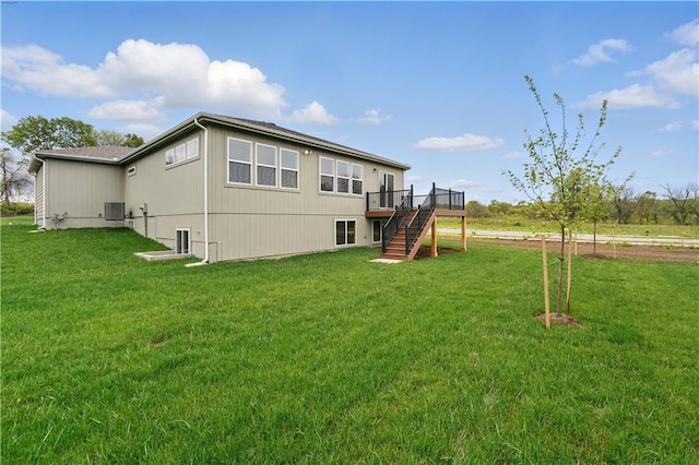 1002 Branchwood Ln, Raymore, MO 64083 - rear view of property with a deck, a yard, central AC, and stairway