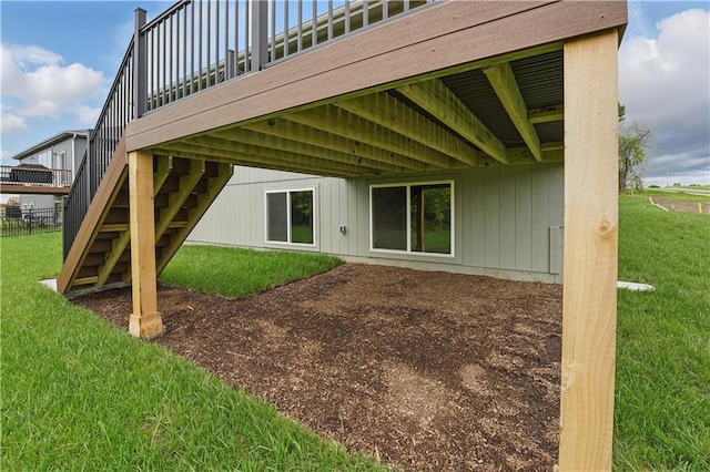 1002 Branchwood Ln, Raymore, MO 64083 - back of house featuring a lawn and stairs