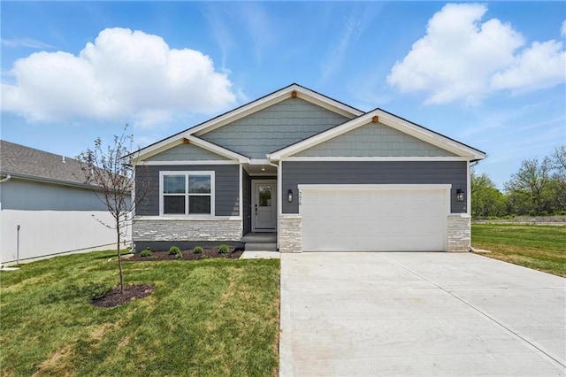 776 Creekmoor Dr, Raymore, MO 64083 - craftsman house with stone siding, an attached garage, a front yard, and driveway