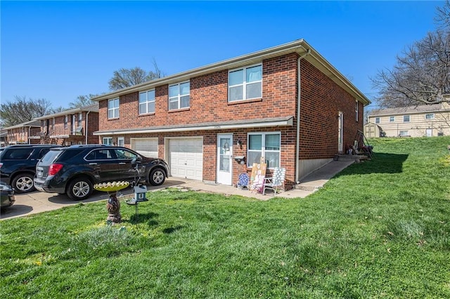 3520 S Lynn St, Independence, MO 64055 - view of front of house featuring brick siding, an attached garage, and a front lawn