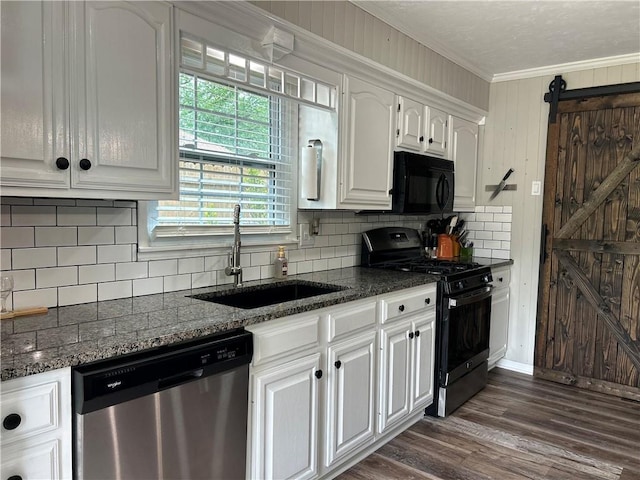 912 Circle Dr, Independence, KS 67301 - kitchen featuring black appliances, a sink, white cabinetry, ornamental molding, and dark wood-style flooring