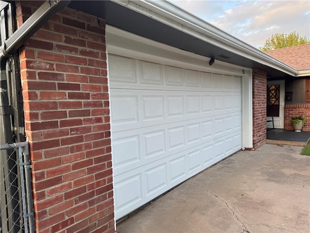 912 Circle Dr, Independence, KS 67301 - garage with concrete driveway