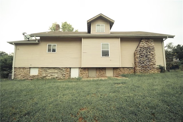3344 S Benton Ave, Kansas City, MO 64128 - back of house featuring a lawn