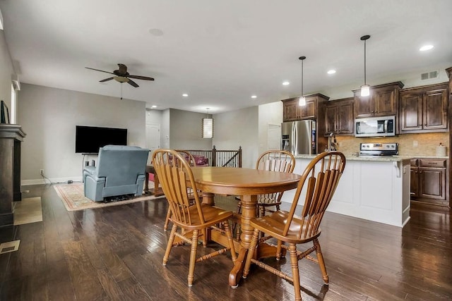 dining area featuring recessed lighting, ceiling fan, dark wood-style floors, and visible vents