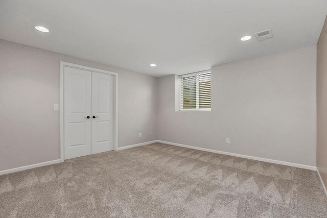 interior space with baseboards, carpet flooring, visible vents, and recessed lighting