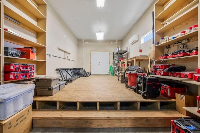 storage room with a wall mounted AC