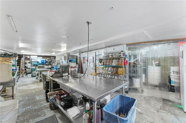 kitchen with unfinished concrete flooring