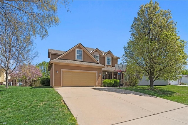 traditional-style house featuring concrete driveway and a front yard