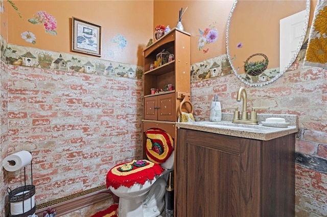 half bathroom with toilet and vanity