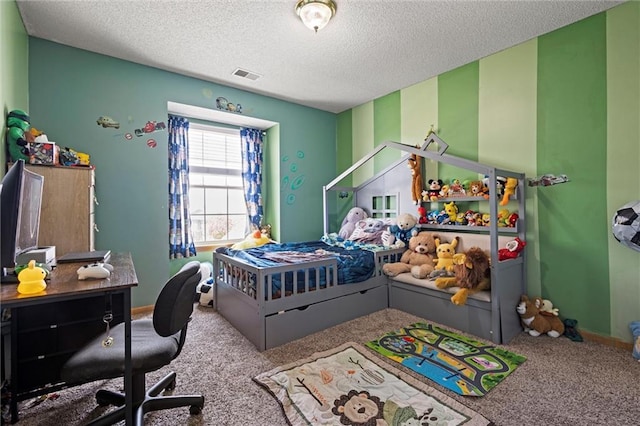 bedroom featuring visible vents, carpet flooring, a textured ceiling, and baseboards