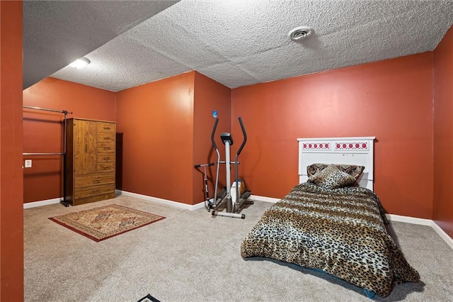 carpeted bedroom featuring a textured ceiling, baseboards, and visible vents