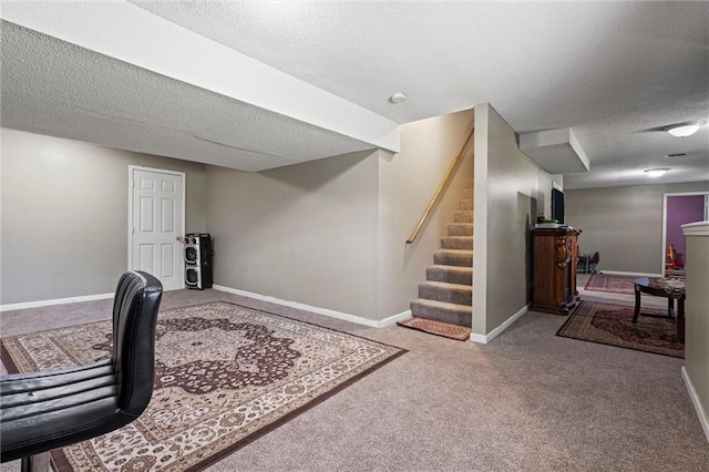 office space with baseboards, carpet, and a textured ceiling