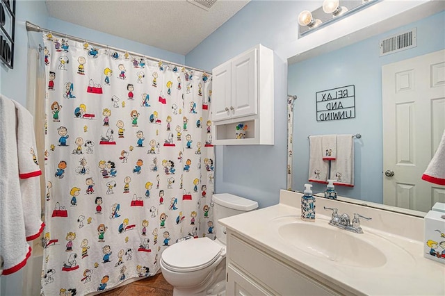 401 NW 51st St, Gladstone, MO 64118 - bathroom featuring vanity, toilet, a shower with shower curtain, a textured ceiling, and tile patterned floors