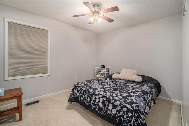 401 NW 51st St, Gladstone, MO 64118 - carpeted bedroom with baseboards and a ceiling fan