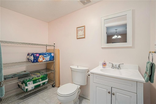 401 NW 51st St, Gladstone, MO 64118 - half bathroom featuring vanity, toilet, and tile patterned floors