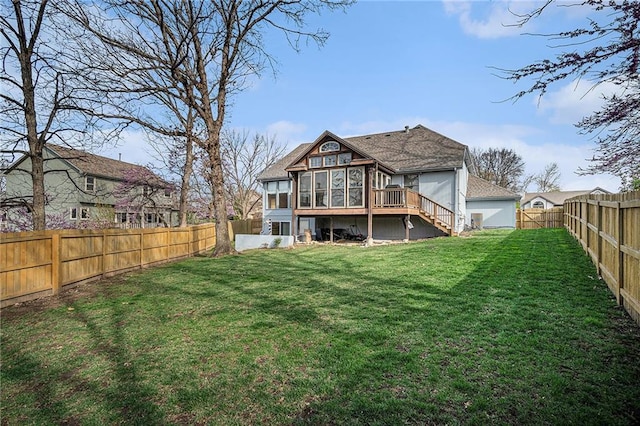 401 NW 51st St, Gladstone, MO 64118 - rear view of property featuring a sunroom, stairs, and a deck