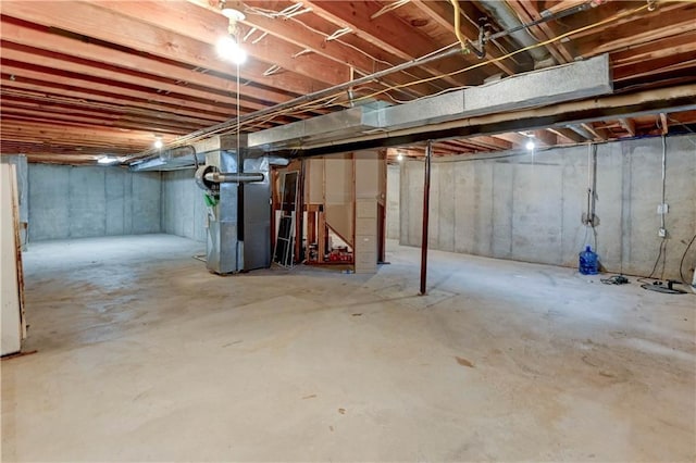 unfinished basement with heating unit