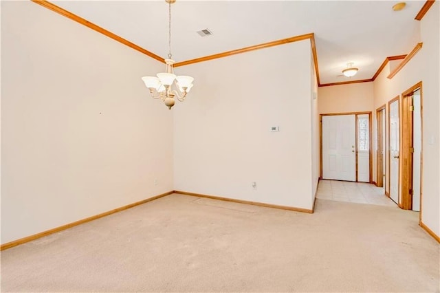carpeted spare room featuring a chandelier, baseboards, and ornamental molding