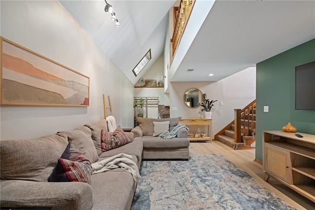 2102 W Dennis Ave, Olathe, KS 66061 - living area with a towering ceiling, wood finished floors, and stairway