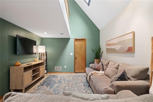 2102 W Dennis Ave, Olathe, KS 66061 - living area featuring baseboards, vaulted ceiling, wood finished floors, and visible vents