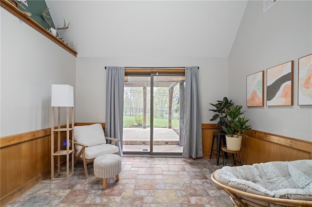 2102 W Dennis Ave, Olathe, KS 66061 - living area with stone finish floor, wainscoting, high vaulted ceiling, and visible vents
