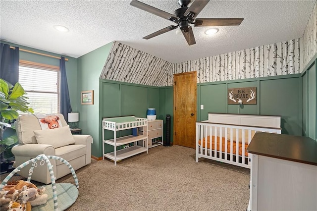 2102 W Dennis Ave, Olathe, KS 66061 - bedroom featuring carpet, a textured ceiling, a ceiling fan, and wallpapered walls