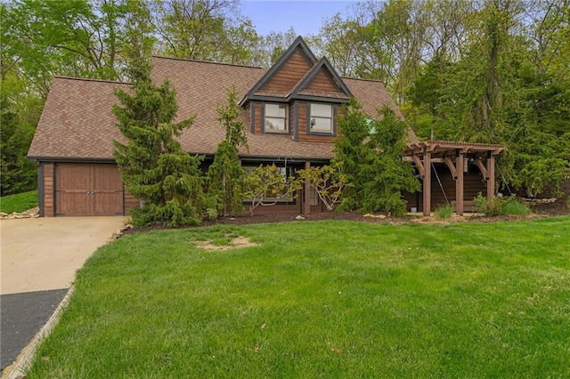 2102 W Dennis Ave, Olathe, KS 66061 - view of front of property featuring concrete driveway, a front lawn, roof with shingles, and a garage