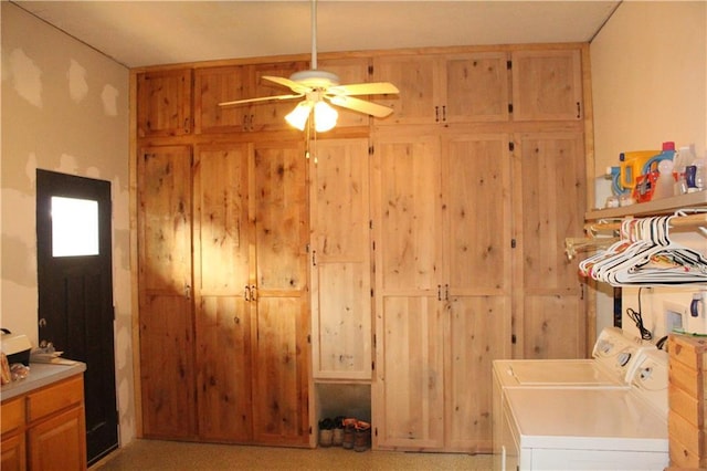 washroom with cabinet space, washer and clothes dryer, and a ceiling fan