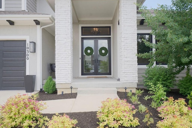 10300 W 174th St, Overland Park, KS 66221 - doorway to property featuring french doors, a garage, and stucco siding