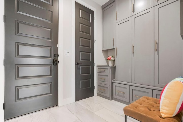 10300 W 174th St, Overland Park, KS 66221 - mudroom featuring light marble finish flooring and baseboards