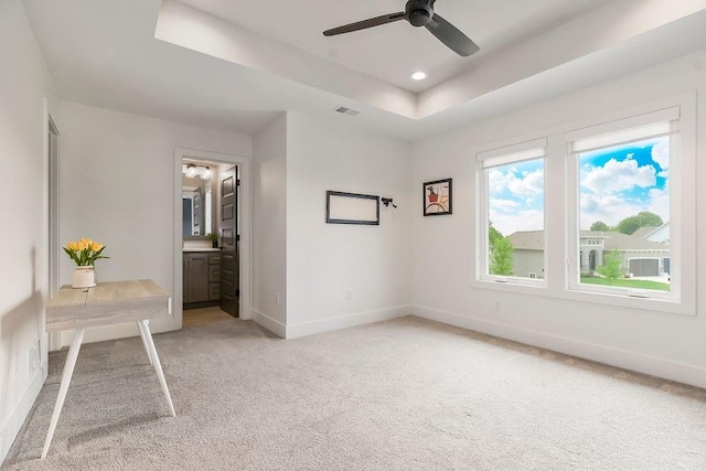 10300 W 174th St, Overland Park, KS 66221 - unfurnished bedroom featuring light carpet, a tray ceiling, baseboards, recessed lighting, and ensuite bath