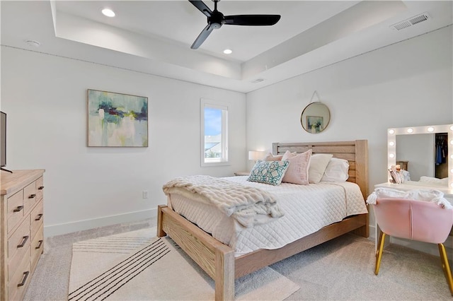 10300 W 174th St, Overland Park, KS 66221 - bedroom with light colored carpet, a tray ceiling, baseboards, recessed lighting, and a ceiling fan