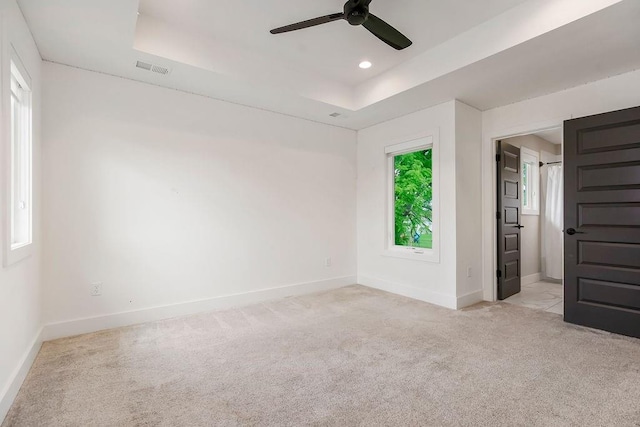 10300 W 174th St, Overland Park, KS 66221 - spare room featuring a raised ceiling, baseboards, light colored carpet, a ceiling fan, and recessed lighting