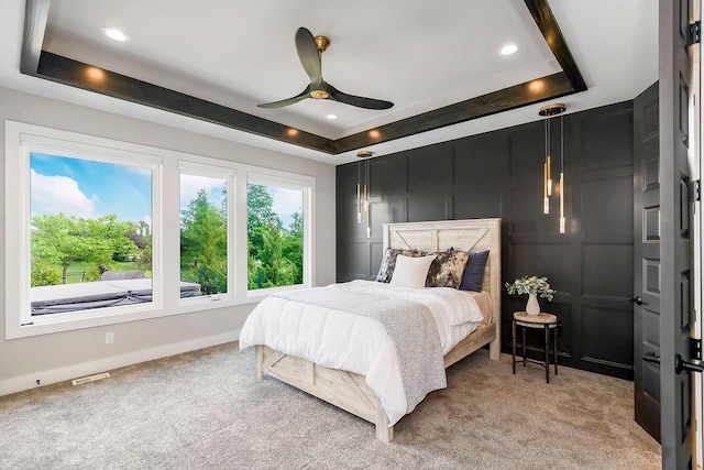 10300 W 174th St, Overland Park, KS 66221 - bedroom featuring a tray ceiling, light colored carpet, recessed lighting, a ceiling fan, and a decorative wall
