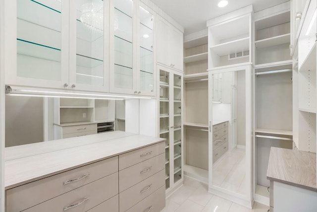 10300 W 174th St, Overland Park, KS 66221 - walk in closet featuring light tile patterned floors