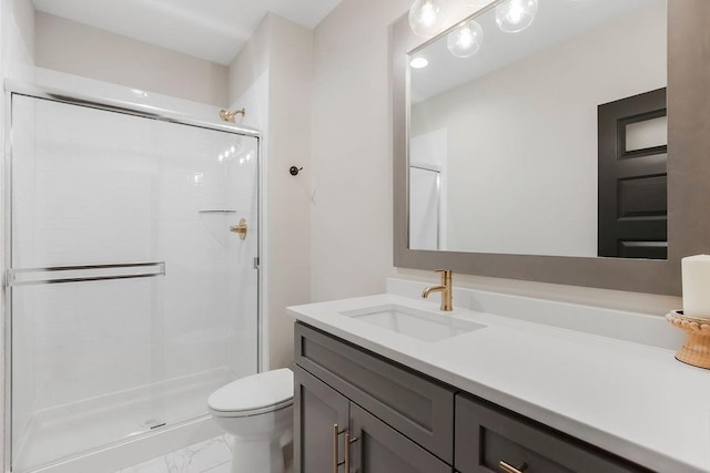 10300 W 174th St, Overland Park, KS 66221 - full bath featuring marble look tile flooring, a stall shower, vanity, and toilet