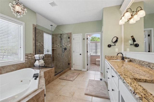 bathroom featuring a notable chandelier, a sink, double vanity, a whirlpool tub, and a shower stall