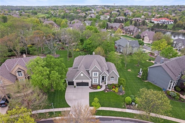 birds eye view of property with a residential view