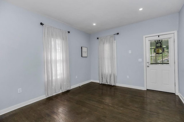3075 N 31st St, Kansas City, KS 66104 - spare room with baseboards, wood finished floors, and recessed lighting