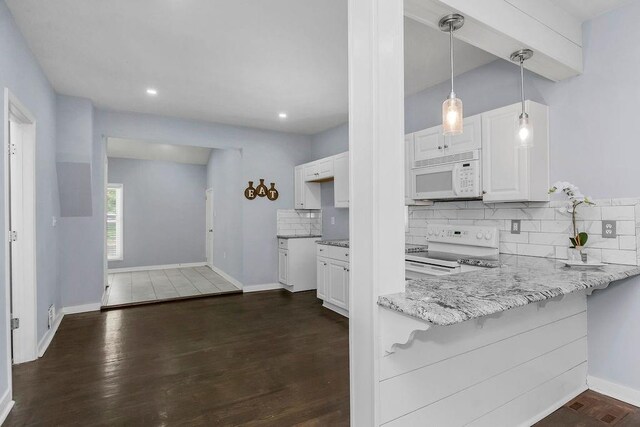 3075 N 31st St, Kansas City, KS 66104 - kitchen featuring light stone countertops, backsplash, white appliances, and white cabinetry