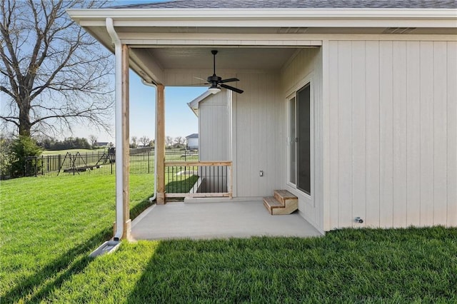 view of patio featuring ceiling fan and fence