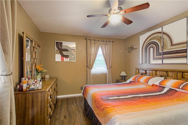 bedroom with baseboards, dark wood finished floors, and ceiling fan